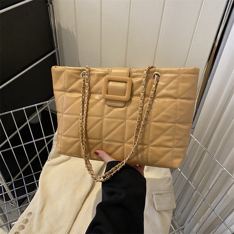 Trendy beige women's shoulder bag with quilted rhombus design and chain strap, PU leather soft texture.