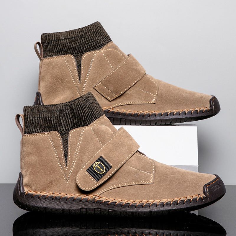 Men's winter ankle boots with Velcro strap, brown suede upper, round toe, flat rubber sole, and knitted sock collar.