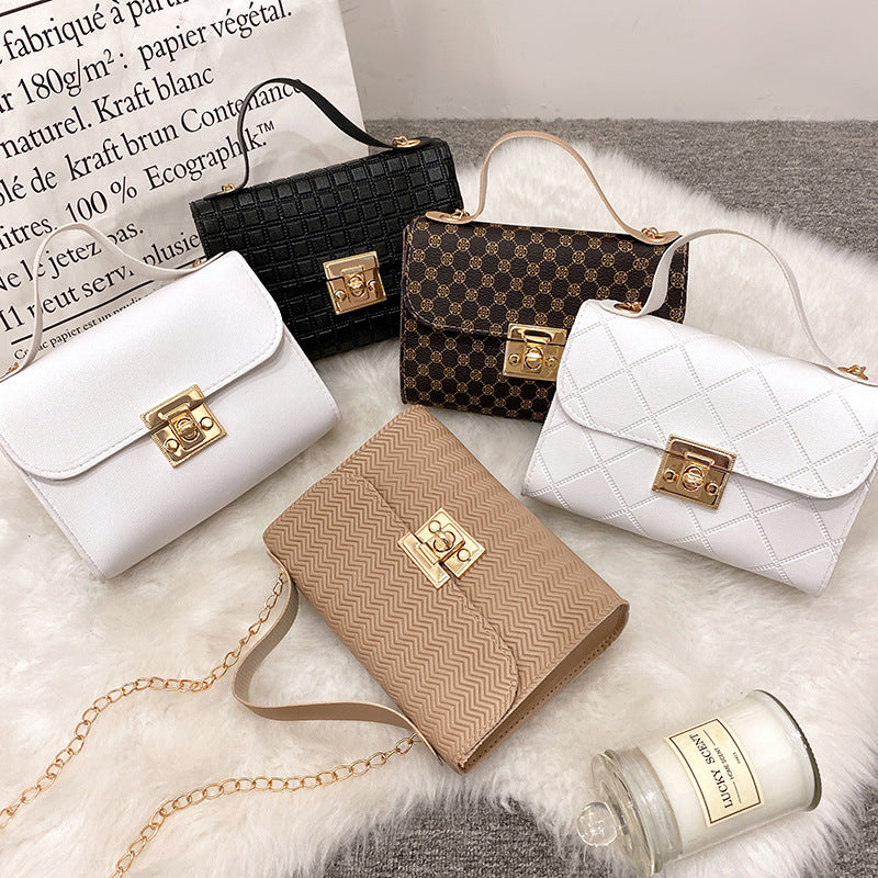 Set of five luxury casual chain crossbody bags for women in black, brown, white, and beige PU leather with gold lock closures.