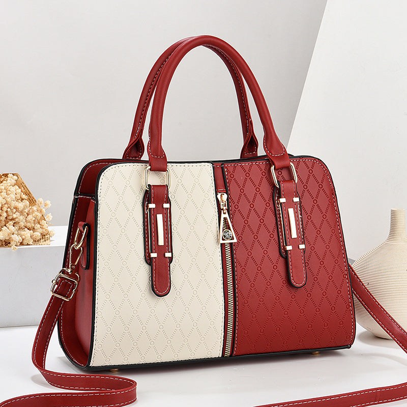 Fashion Color Matching Ladies Handbag with embossed pattern, large capacity, dual handles, and detachable shoulder strap in red and cream colors.