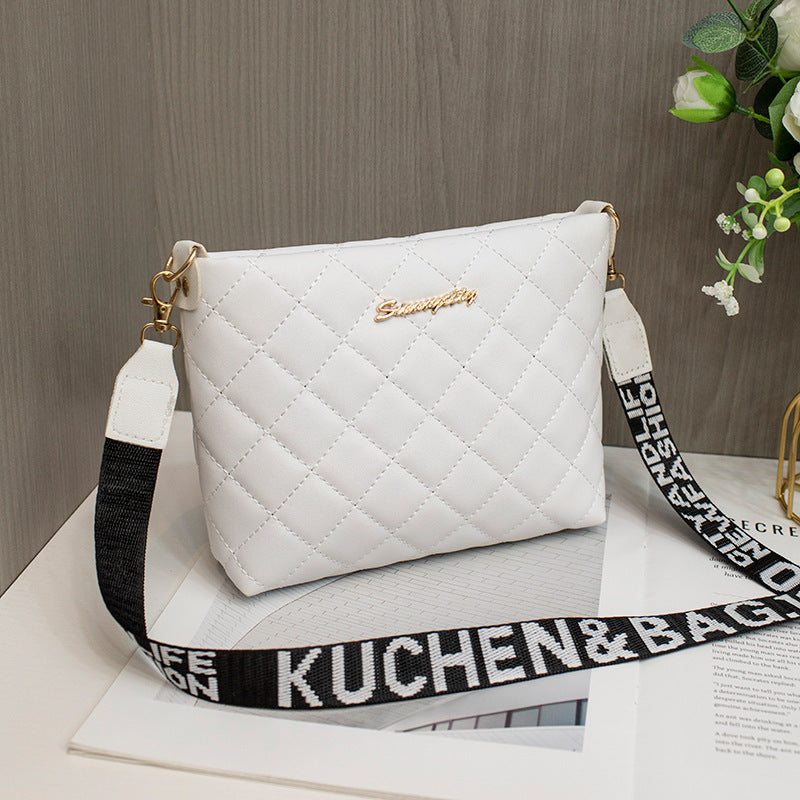 Small white quilted small messenger bag with black adjustable shoulder strap and gold-tone hardware for women crossbody purse