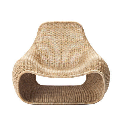 Creative Rattan Courtyard Chair made of natural woven rattan with a minimalist Southeast Asian design and curved leisure seating.