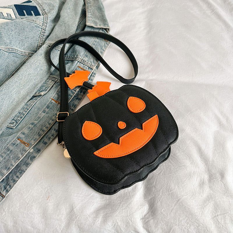 Black Halloween crossbody bag with orange pumpkin face and bat ears design