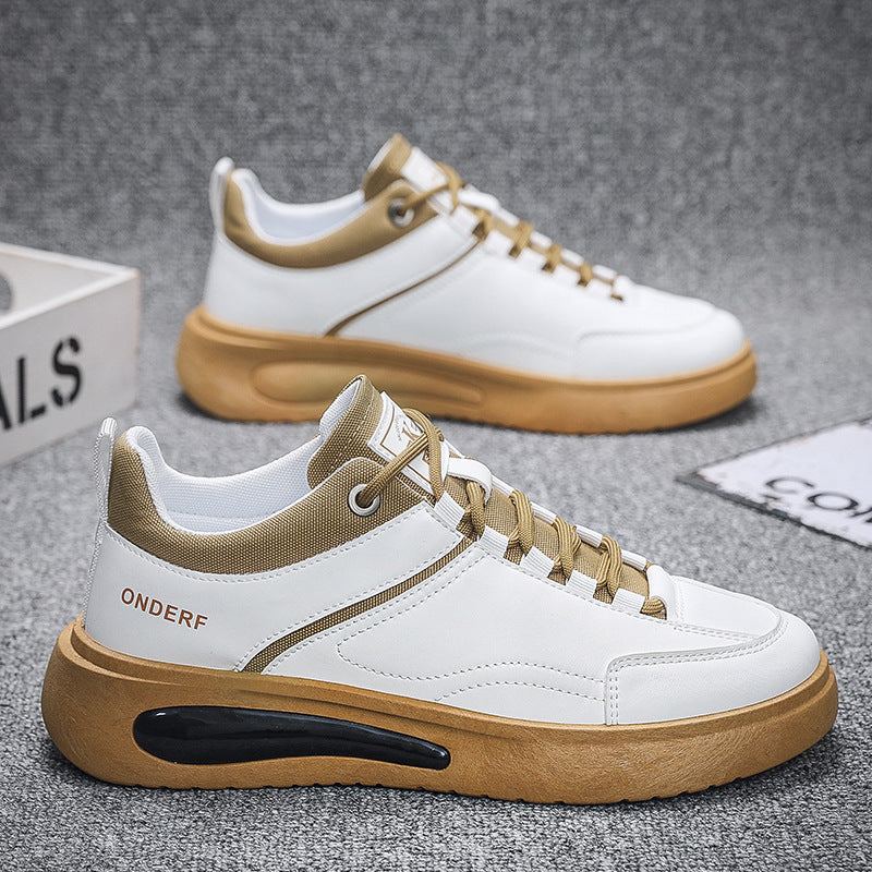 White and brown men's casual shoes with thick gum sole and air cushion design on grey carpet background