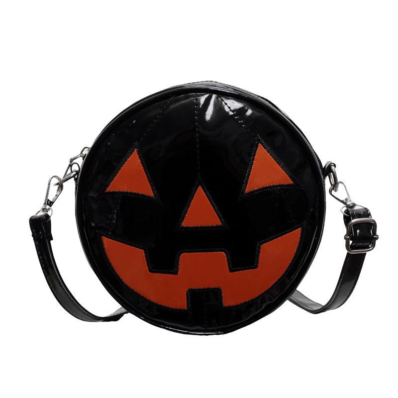 Small round Halloween pumpkin shoulder bag for women with cute jack-o'-lantern design and black PU material