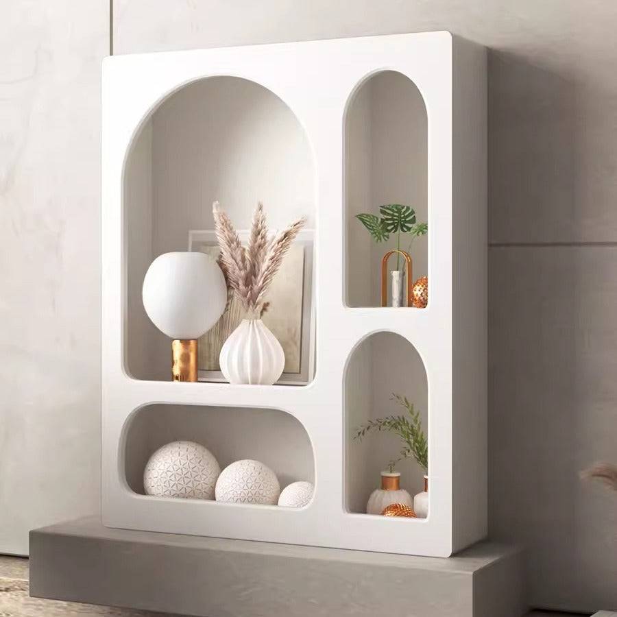 Cream Wind Tunnel Cave Storage Cabinet with arched cave-style compartments in cream white finish displaying modern decor items