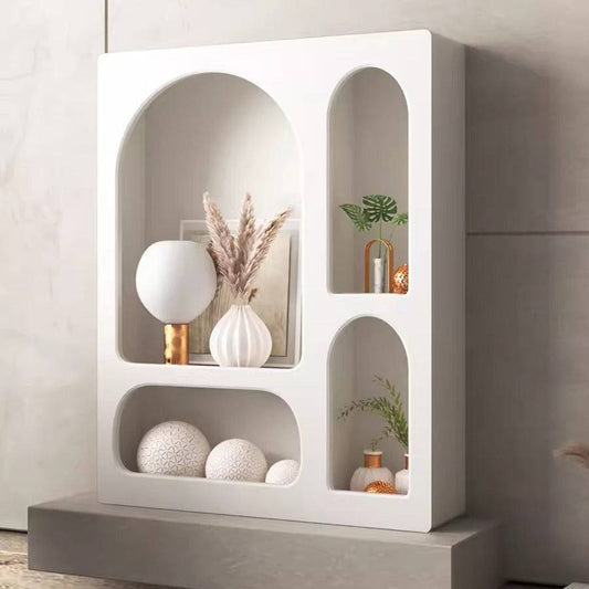 Cream Wind Tunnel Cave Storage Cabinet with arched cave-style compartments in cream white finish displaying modern decor items