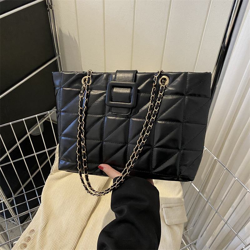 Black women shoulder bag with quilted rhombus pattern and chain strap, chic Chanel-style PU leather handbag.