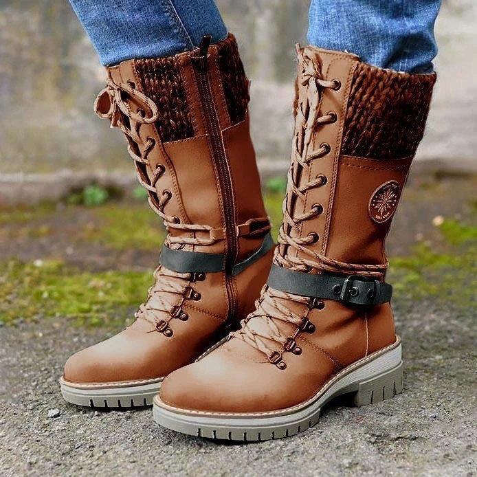Brown winter high square heel round toe Martin boots with knitted cuff, lace-up front, and buckle strap detail, worn with jeans outdoors